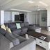 Royal Palm Resort in Palm Beach living room with sectional sofa and coffee table