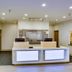 Quality Inn & Suites Bethany - Oklahoma City West lobby with front desk and seating area in Bethany