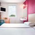 Hotelf1 Toulon Est la Valette room with twin beds, window, wall-mounted TV, and colorful photo mural