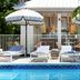 Winslow's Bungalows - Key West Historic Inns poolside loungers and umbrellas in Key West