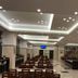 Toyoko Inn Narita Airport Honkan in Narita lobby with rows of dining tables and ceiling lights