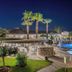 Golden Coast Hotel & Bungalows in Marathon with illuminated pool, palm trees and outdoor dining at night
