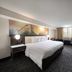 Holiday Inn Brookfield - Milwaukee by IHG guest room with king bed, desk, TV and window seating in Brookfield