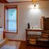 5 Ojo Inn Bed & Breakfast, Eureka Springs: bathroom with soaking tub, window, and vanity