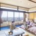 Ooedo Onsen Monogatari Premium Seiunkaku in Awara guest room with futon beds and mountain view