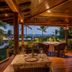 Pousada Estrela D' Agua in Trancoso: open-air restaurant with ocean view and palm trees