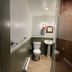 Bailey House in Annapolis Royal bathroom with toilet, pedestal sink and glass shower