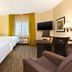 Candlewood Suites Morgantown-Univ West Virginia guest room with two beds, desk, TV and window