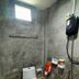 Tonkong Guesthouse & Restaurant in Chiang Khan bathroom with toilet, sink, shower, and window