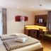 Hotel am Wiesenhang - Garni room in Bad Kohlgrub with twin beds, desk nook, and TV