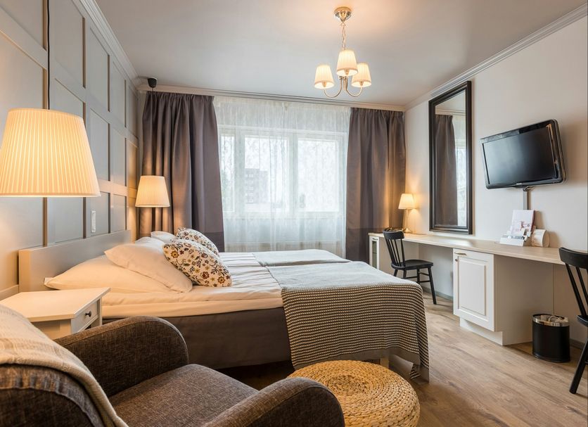 Original Sokos Hotel Kaarle, Kokkola guest room with bed, window, desk and wall-mounted TV