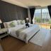 Jomtien Beach Penthouses in Pattaya bedroom with balcony, mountain view and floor-to-ceiling windows