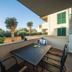 Pervanovo Apartments in Dubrovnik balcony with outdoor dining table and palm tree views