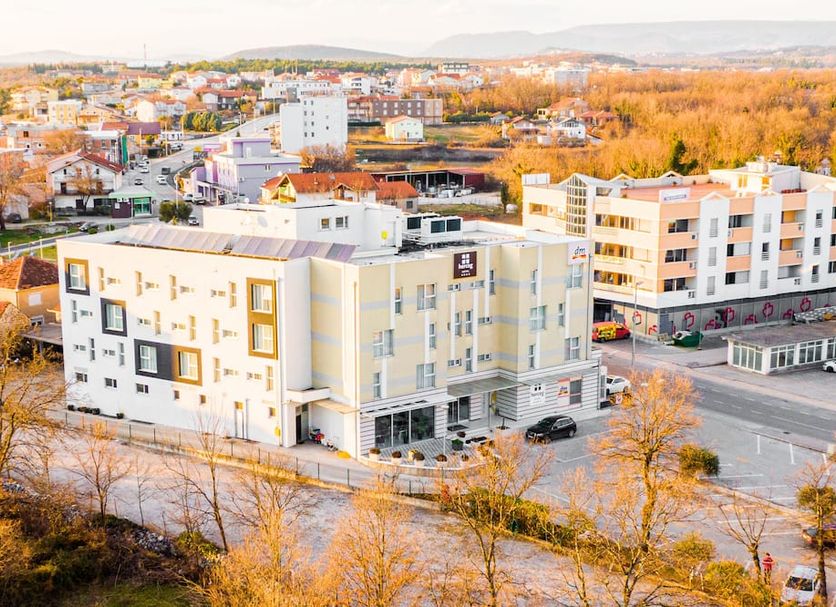 Hotel Herceg in Medjugorje, exterior view of the hotel and surrounding autumn townscape