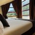 Wuau! Hotel Galanthus & Spa in Soldeu bedroom with mountain views through large windows