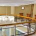 Royal Garden Hotel Ozamiz interior mezzanine with circular chandelier and railing