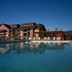 Poolside view of Wyndham Vacation Resorts Steamboat Springs with mountain lodge-style buildings
