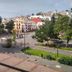Hotel del Vasco in Zacatecas with a plaza view, trees, and hillside buildings