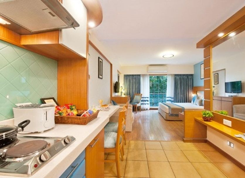 Grand Residency Hotel & Serviced Apartments in Mumbai: serviced apartment with kitchenette and sitting area
