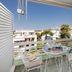 Seaside Secret by BluPine in Vouliagméni balcony with table, chairs, swing sofa and city view