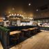 Kensington Resort Gyeongju restaurant with floral chandeliers and bar seating in Gyeongju