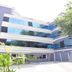 Rkn Hotel Pondicherry exterior with modern glass facade and landscaped entrance