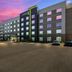 Home2 Suites By Hilton Cookeville exterior at dusk with colorful sky and parking lot