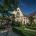 Kruisherenhotel Maastricht, Maastricht: historic stone hotel exterior with manicured garden and arched windows