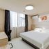 Jinjiang Inn (Huizhou Dadao Hefei) guest room with double bed, desk, and window in Hefei