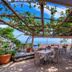 Locanda Degli Agrumi in Conca Dei Marini: terrace dining area with sea view and pergola vines
