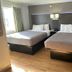 Quality Inn Fishers - Indianapolis guest room with two double beds and a window in Fishers