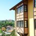La Solana Montañesa in Comillas with hillside town views beside a timber-framed hotel exterior