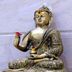 Tr Residency in Pondicherry features a golden Buddha statue seated on an ornate base