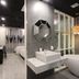 Hotel De Ciel Seoul bathroom with freestanding tub, vessel sink and geometric mirror