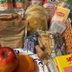 Breakfast basket at Americas Best Value Inn & Suites Royal Carriage, Jamestown, with fruit, muffins, juice and tea