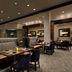 Hilton Philadelphia City Avenue restaurant with booth seating and tables in Philadelphia