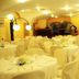 Hotel Ristorante Vecchia Riva in Varese: bright banquet hall with round tables and white chair covers