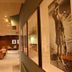 Isle Of Mull Hotel and Spa lounge corridor with leather seating and framed wall art on the Isle of Mull