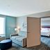 Home2 Suites by Hilton Tampa - USF/Near Busch Gardens room with open door to bedroom