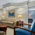 Club Wyndham Sea Gardens living room in Pompano Beach with sofa, armchairs and balcony view
