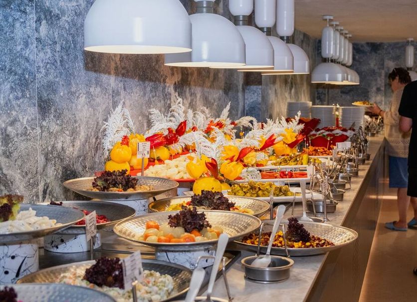 Kleopatra Dreams Beach Hotel Alanya buffet with fruit platters and hanging pendant lights