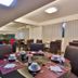 San Diego Suites Pampulha Hotel dining area in Belo Horizonte with set tables and dark chairs