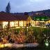 Hotel Marqués de la Moral in Castrillón (Aviles), lit exterior with garden and courtyard at dusk