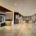 Courtyard by Marriott Bali Nusa Dua Resort lobby with buffet stations and seating in South Kuta