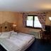Residence Ruetoreif bedroom in Gressoney-Saint-Jean with double bed, window and desk