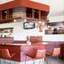 Bastion Hotel Barendrecht bar with counter seating and TV in Barendrecht