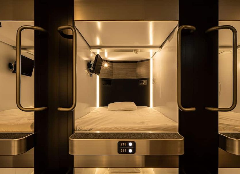Capsule Plus Yokohama Sauna & Capsule in Yokohama, capsule pod sleeping area with private bunk beds