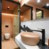 Pavo Art Hotel in Heraklion bathroom with freestanding sink, walk-in shower, and wall-mounted toilet