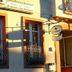Hotel Am Markt in Eckartsberga exterior with two windows and hanging restaurant sign