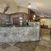 Best Western PLUS Truckee-Tahoe Hotel in Truckee lobby front desk with stone counter and mounted deer head